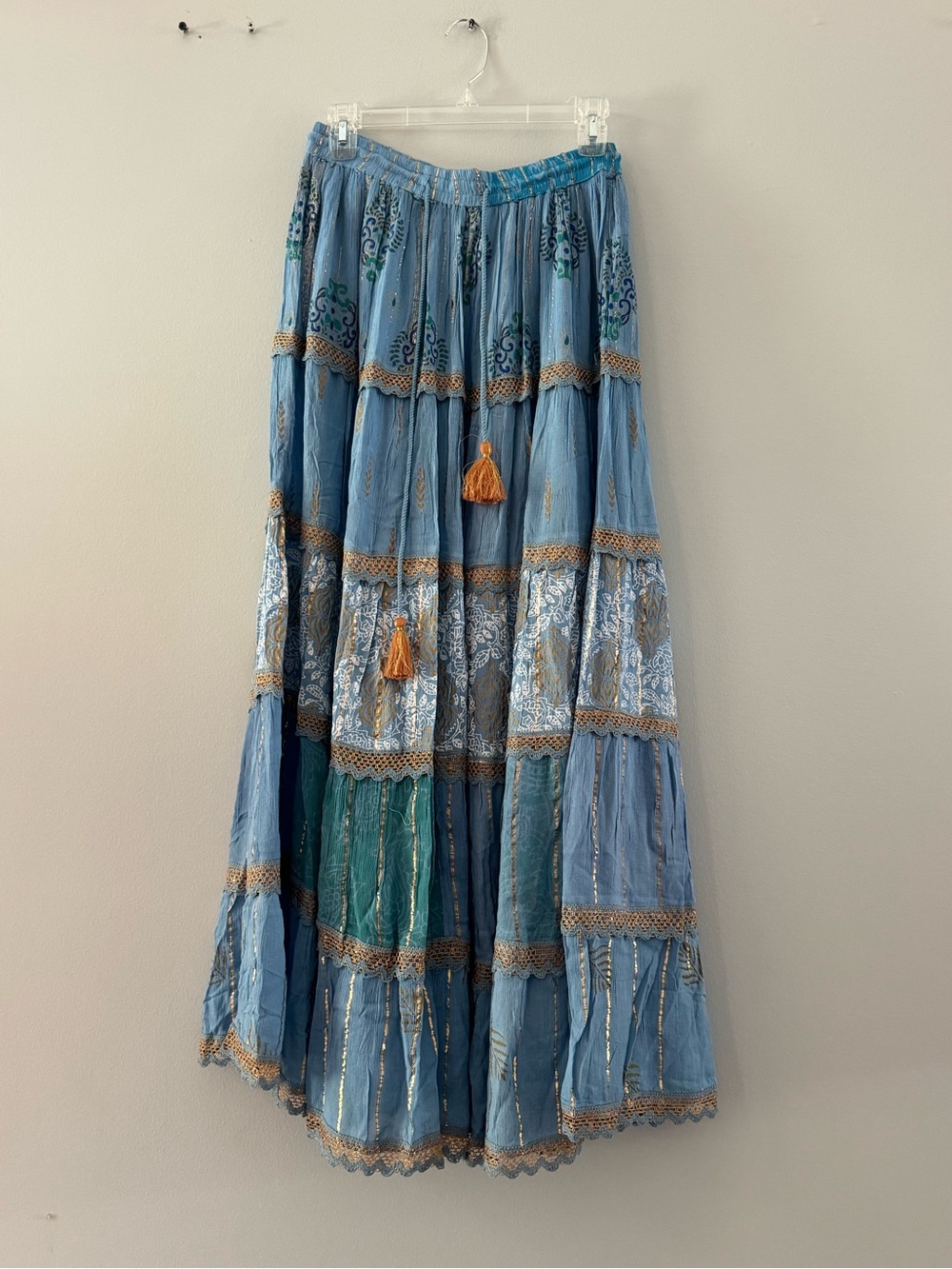 Ananta Blue Tiered Maxi Skirt with Tassels, gold threading, has a matching skirt